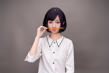 A girl in white on a gray background