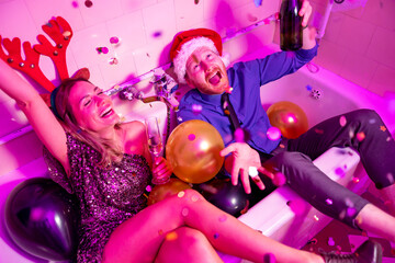 Couple drinking champagne at New Year party midnight countdown
