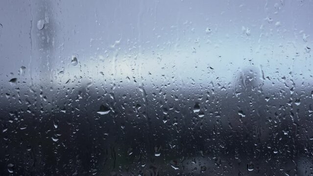 Raindrop sliding down a window