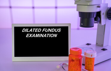 Medical tests and diagnostic procedures concept. Text on display in lab Dilated Fundus Examination
