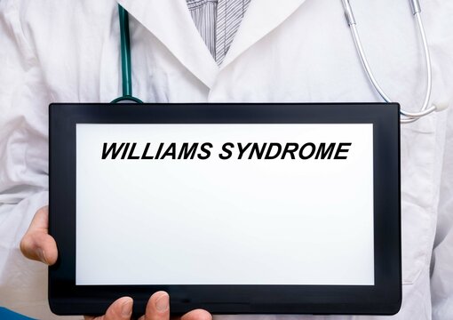 Williams Syndrome.  Doctor with rare or orphan disease text on tablet screen Williams Syndrome