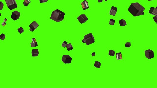 Isolated chocolates fall down in front of green screen. Chocolate dominoes for Christmas background. 29,97 fps