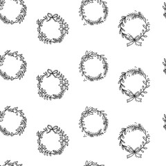 Seamless pattern of black outline christmas wreath and decorations on white background. Doodle hand drawn style. Happy new year.