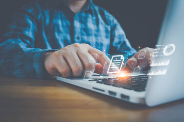 Hand with document icons and typing to laptop computer, Online documentation database and document management system concept. Process automation to efficiently manage files.