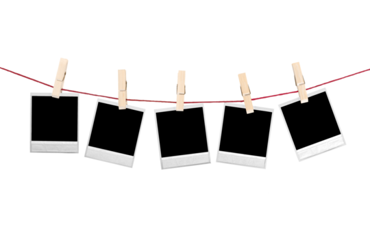 five polaroid photos hanging isolated on white