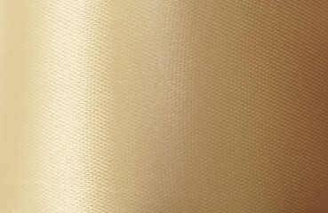 close up macro antique golden silk fabric ribbon texture abstract background with copy space.idea for luxury wallpaper,elegance fashion backdrop design.