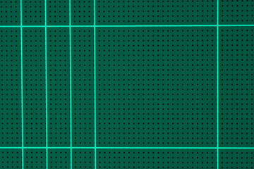 rubber green cutting mat sheet with grid guide line scale square shape background.for paper tools,school or graphic craft studio equipment backdrop design.