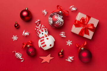 Christmas toys and decoration on color background, top view