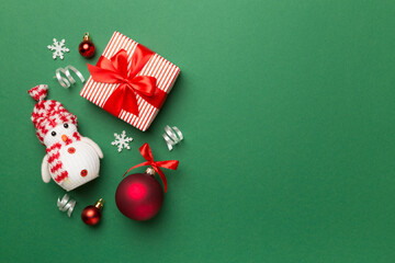 Christmas toys and decoration on color background, top view