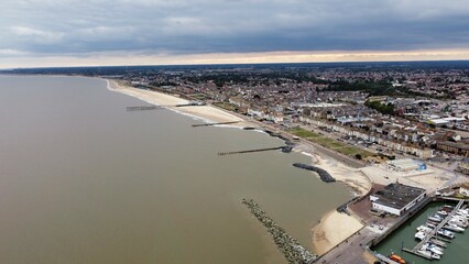 Aerial view of Lowestoft harbour and port with boats docked and far reaching views. Lowestoft England. 