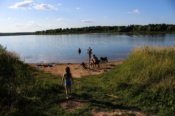 River with people resting on the shore