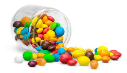 Colorful candies sweets falling out of a glass jar, composition isolated over the white background