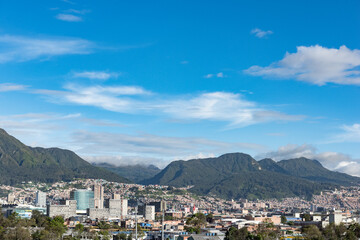 Fototapeta na wymiar Bogotá, Colombia. May 23, 2022: Panoramic and urban landscape of the city with blue sky.