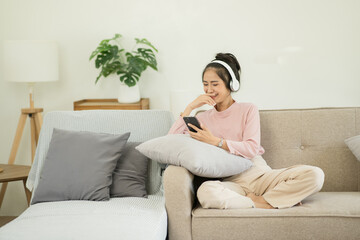 Asian women watch movies, listen to music, talk on the phone at home