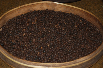 Coffee beans drying on woven basket. Coffee beans harvest