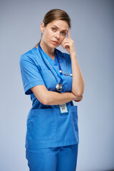 Serious thinking doctor or nurse woman. Isolated female portrait.