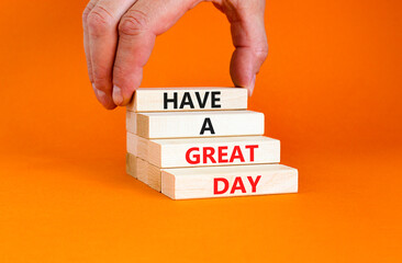 Have a great day symbol. Concept words Have a great day on wooden blocks. Beautiful orange table orange background. Businessman hand. Business, psychological Have a great day concept. Copy space.