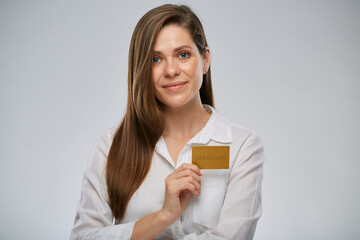 Fototapeta premium Smiling woman in white shirt holding credit card. Isolated advertising female portrait on white.