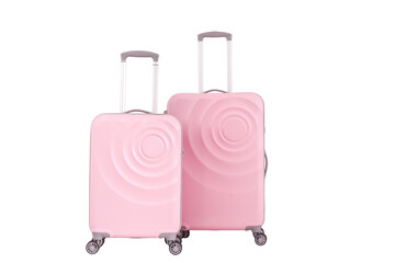 Two girly pink plastic suitcases with transparent background, vacation luggage in front view