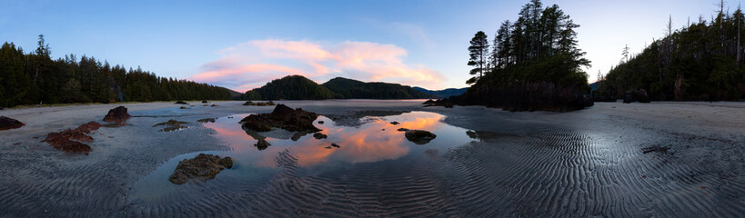 Fototapeta premium Sandy beach on Pacific Ocean Coast Panoramic View. Sunset Sky. San Josef Bay, Cape Scott Provincial Park, Northern Vancouver Island, BC, Canada. Canadian Nature Background Panorama
