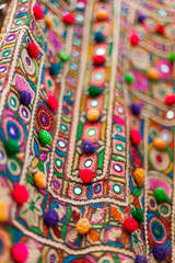 Details of embroidered traditional dress, ornemented with mirrors, Meghwal tribal style, Kutch region, Gujarat, India - obrazy, fototapety, plakaty