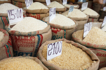 PAHARGANJ, OLD DELHI, INDIA: close-up of price tags on bags full of rice