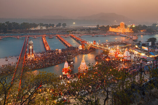 HARIDWAR, UTTARAKHAND, INDIA:crowd of Indian pilgrims gathering for prayers by the Yamuna River, Har-Ke-Pauri Ghat, Khumb Mela festival, Makar Sankranti celebration