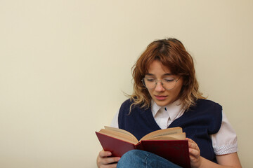Girl reading with a sad face