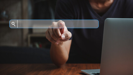 man hand searching browsing for information internet data Technology on computer keyboard...