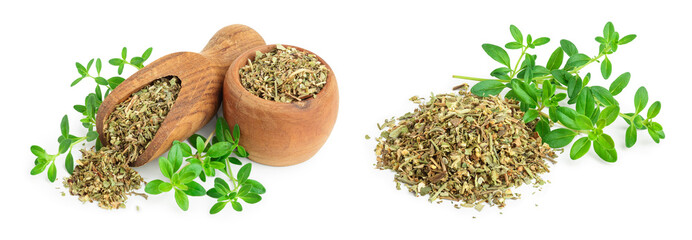 Dried thyme leaves in the wooden bowl and scoop, with fresh thyme isolated on white background. Top view