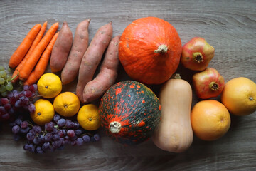 Various healthy autumnal food on wooden table. Top view.