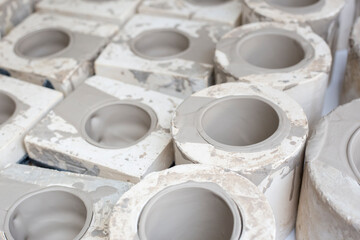 ceramic pieces in plaster molds, craft process