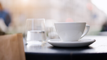 Coffee cup on table at street cafe        