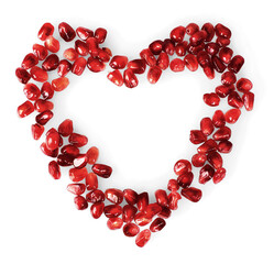 Pomegranate seeds in shape of heart on white background