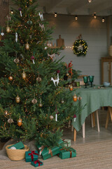 Christmas background with decorated gift boxes under  Christmas tree. Festive home decorations.