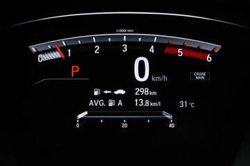 Digital car dashboard with tachometer, speedometer, driving distance, the temperature outside the...