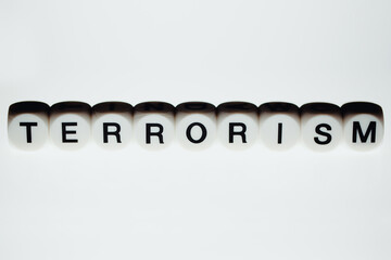 Terrorism. Cubes with letters on a light background