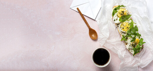 Toast with cream cheese, arugula salad and boiled egg