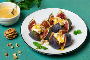 Figs stuffed with cream cheese with honey sauce and walnuts
