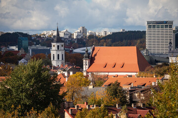 Vilnius old town cityscape with the belfry of Vilnius Cathedral and side facade of Church of St. Michael the Archangel