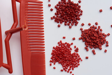 produced red comb with plastic granulate / raw material