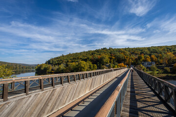 Historic Roebling Bridge also known as Roebling's Delaware Aqueduct over the Delaware River on a brilliant fall morning