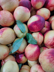 ripe juicy yellow-red nectarines on the counter in the supermarket