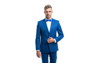 confident formal man in blue tuxedo bowtie isolated on white background