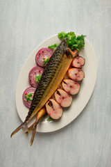 Smoked mackerel, top view, with spices, on a wooden table, no people, selective focus,