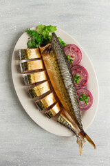 Smoked mackerel, top view, with spices, on a wooden table, no people, selective focus,