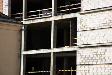 Construction site and construction of tall building from blocks