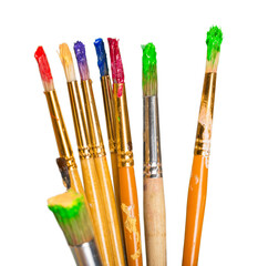 Row of artist paint brushes  on background