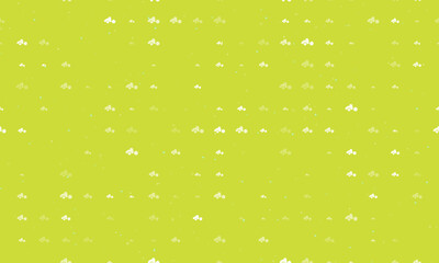 Seamless background pattern of evenly spaced white road roller symbols of different sizes and opacity. Vector illustration on lime background with stars