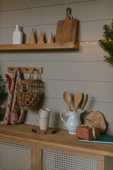 Wooden kitchen countertop with decor. The kitchen decorated for the Christmas holidays. Aesthetic home atmosphere.